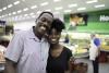 Grocery store owner hugs his daughter