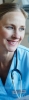 Woman doctor in blue scrubs wearing a stethescope